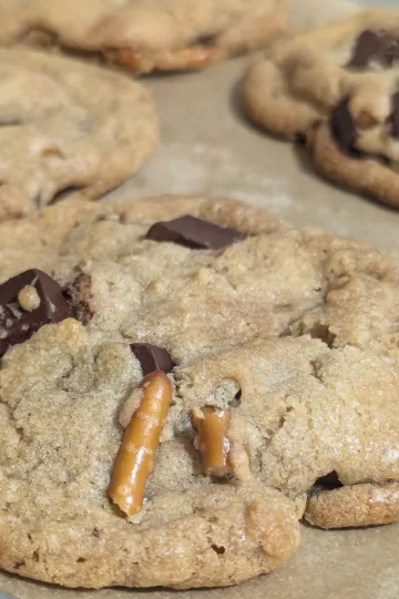 Pretzel Chocolate Chunk Cookies on parchment paper.