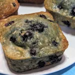 Blueberry oatmeal muffins on a plate.