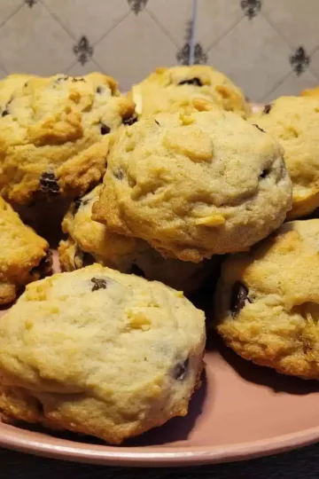 A plate with a pile of Bourbon Chocolate Chip Cookies on it.
