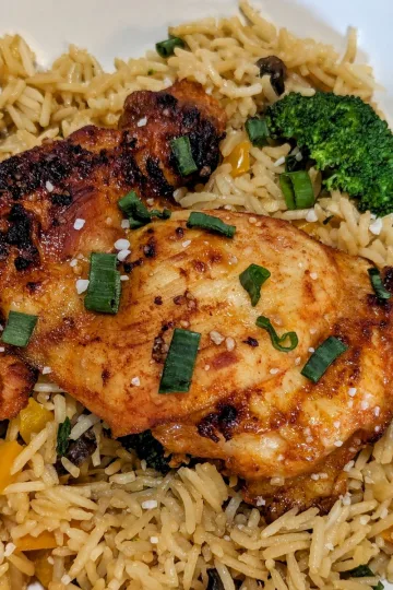 Gochujang thighs on a bed of rice.