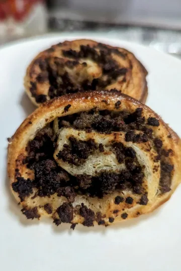 Two Tourtiere pinwheels on a plate.