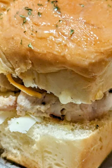 Slider bun with ranch seasoned chicken and bacon.