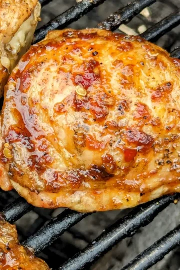 A sambal oelek marinated chicken breast on the BBQ.