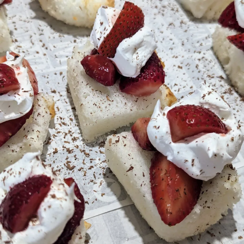 Easy Strawberry Shortcake Bites on a paper-lined tray.