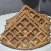 Quartered cinnamon waffles on a plate.