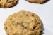 Pumpkin Chocolate chip cookies on a parchment lined baking sheet.