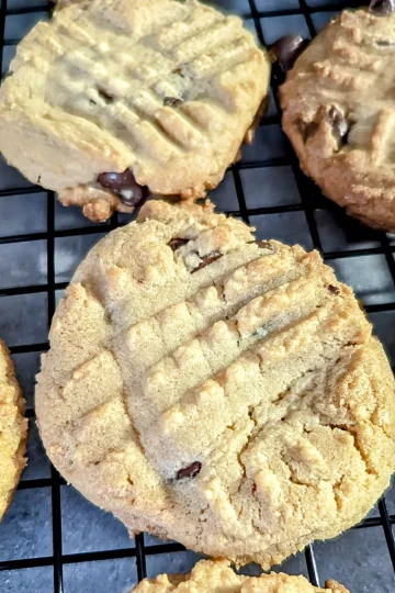 Peanut Butter Chocolate Chip Cookies on a wire rack.