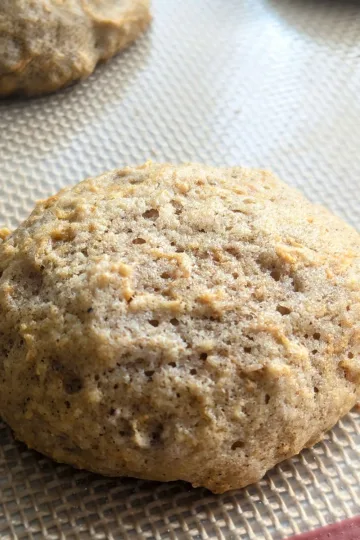Carrot cookie on a silicone mat.