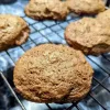 Chocolate beer cookies on a cooling rack.