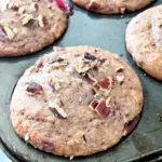 Close up of a cranberry sauce muffin in a pan.