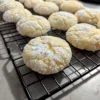 Lemon Crinkle Cookies on a cooling rack.